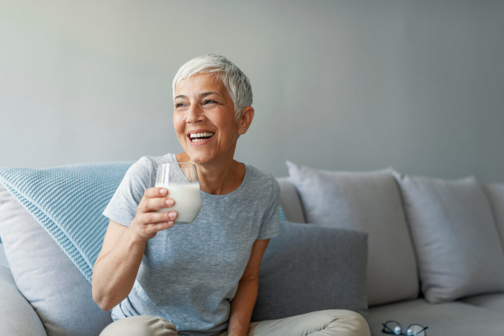 Woman experiencing phases of menopause looking confident and reflective.