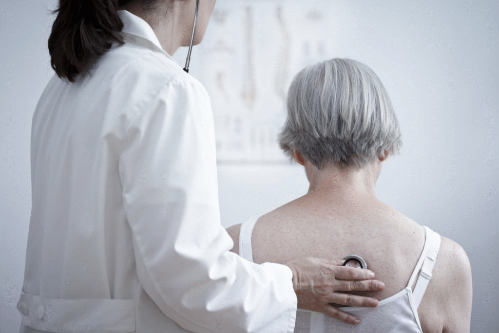 Woman in doctor’s office seeking natural treatment for pneumonia.