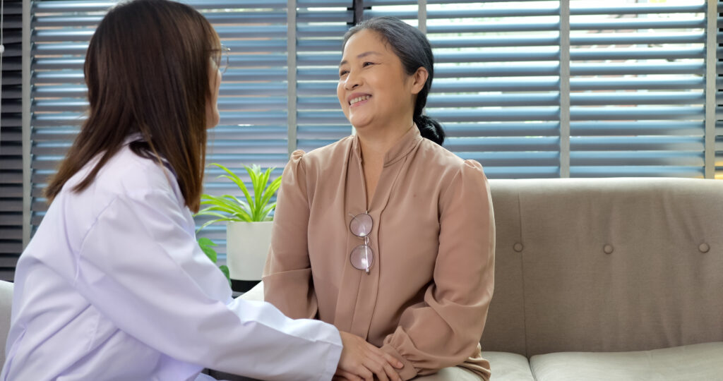 Woman having a conversation with her doctor about menopause symptoms.